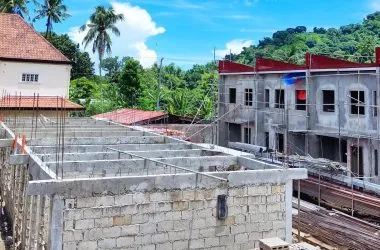 Construction progress photo — slab formwork with neighbouring structures