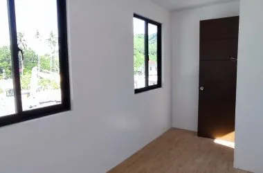Interior photo — empty room with window and door